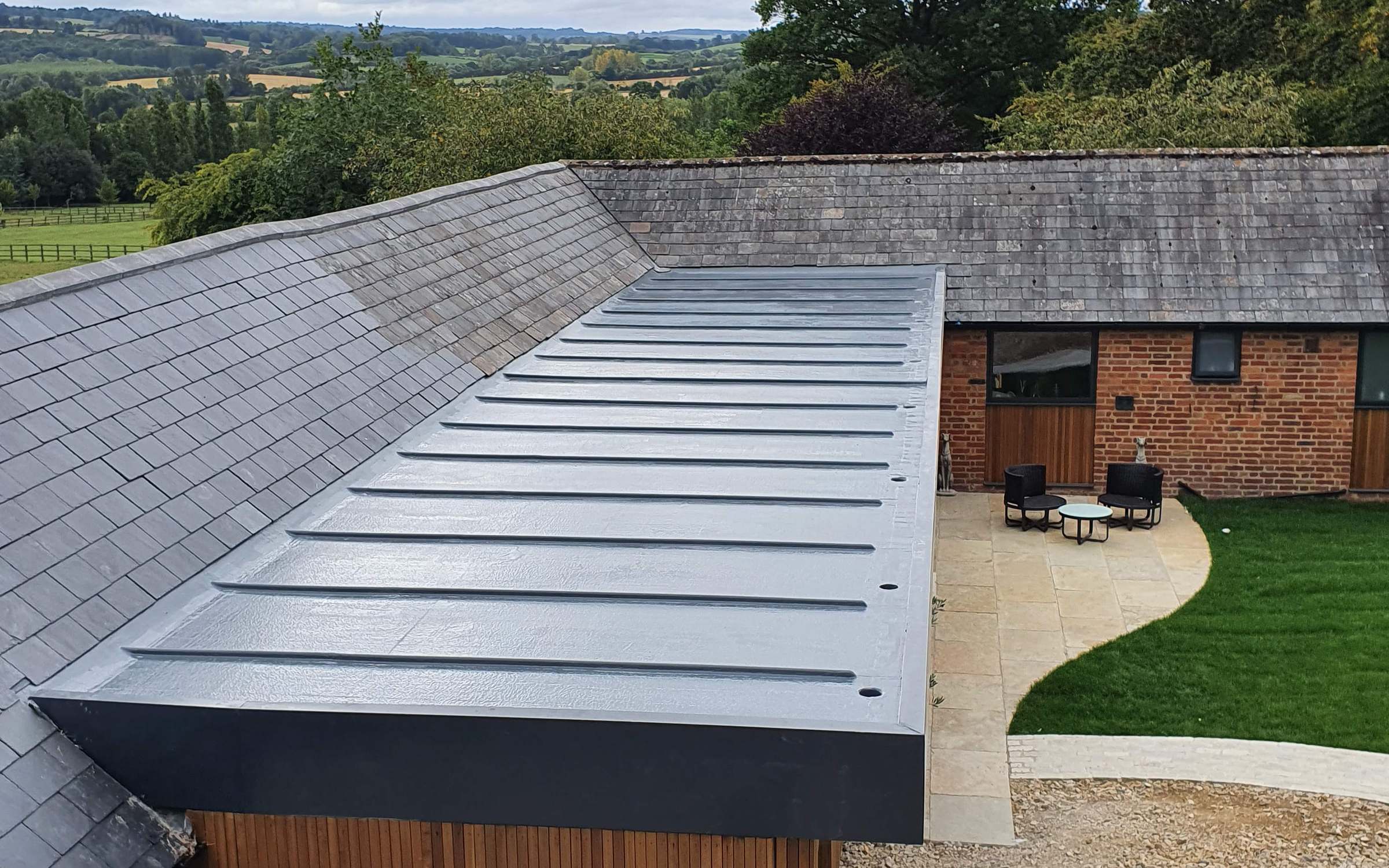 A finished flat roof with rooflights on a single-storey extension
